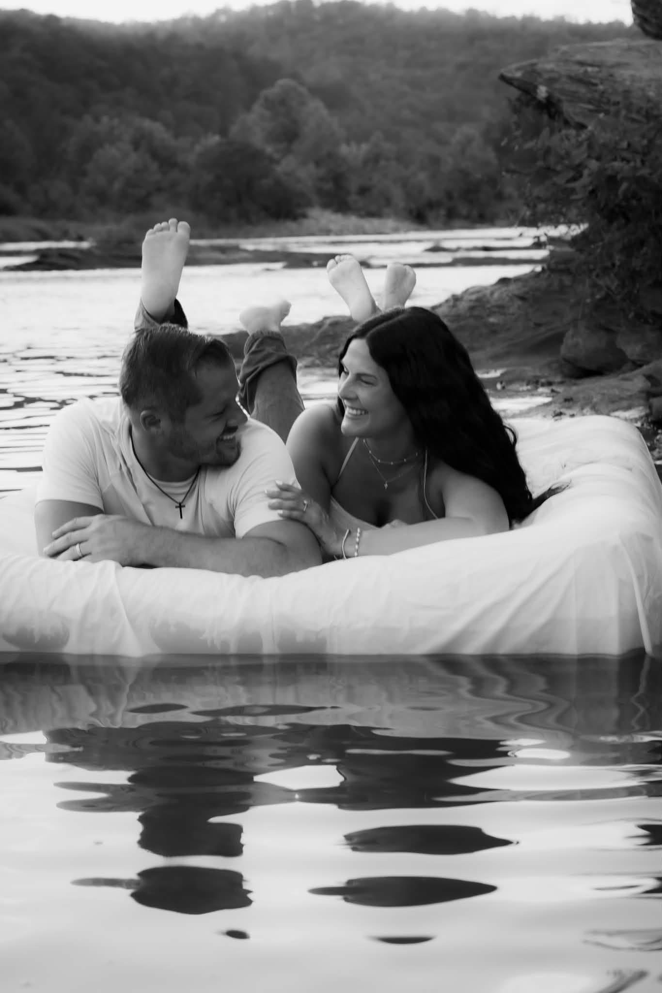 Couple laughing together at a riverside session