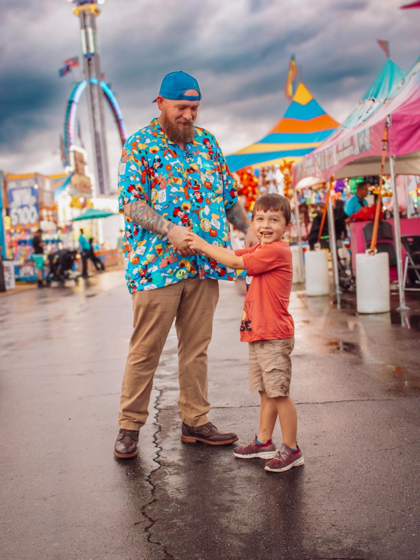 Father and son enjoying a special day together at a fairground
